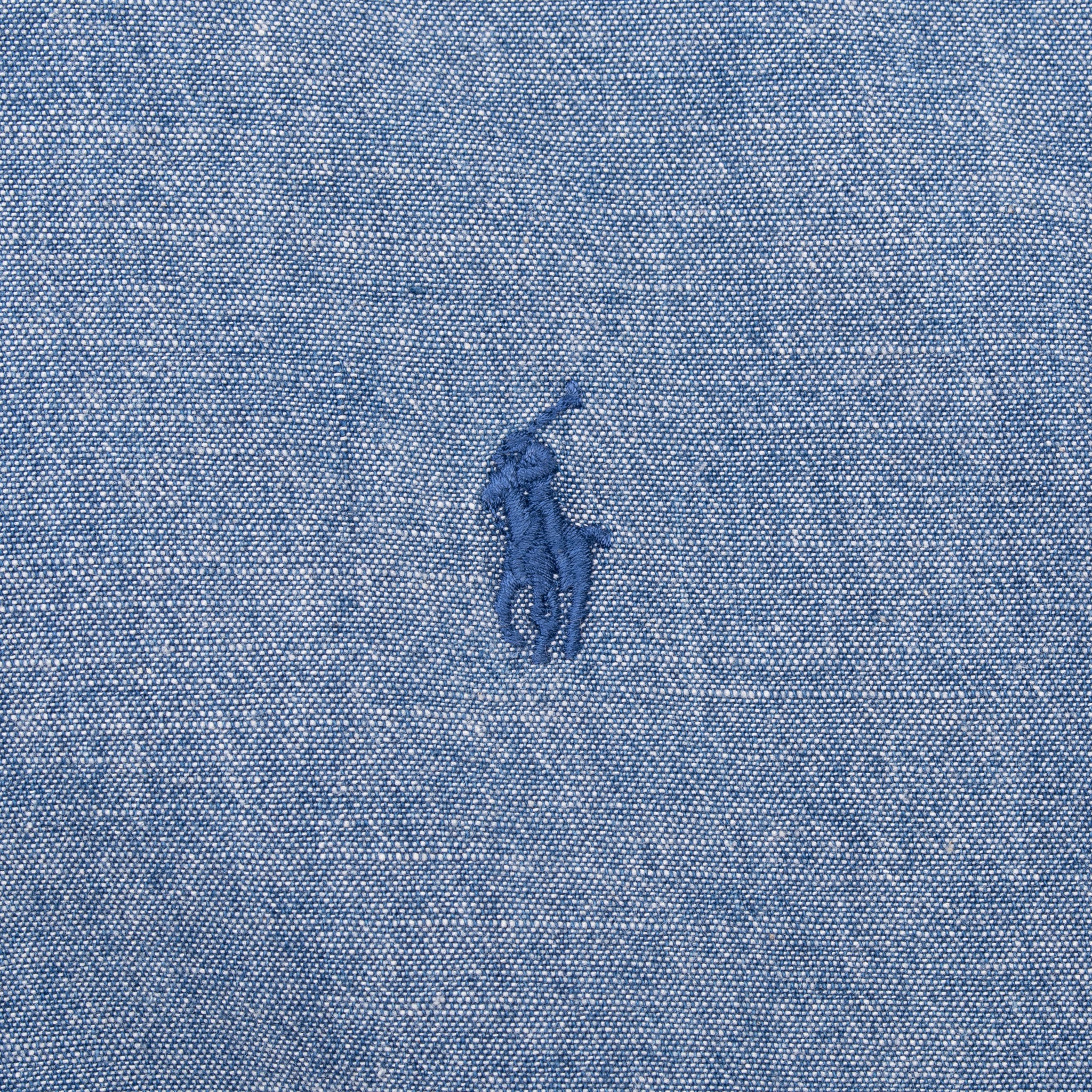 Close-up of tonal blue embroidered Polo pony logo on Ralph Lauren chambray shirt