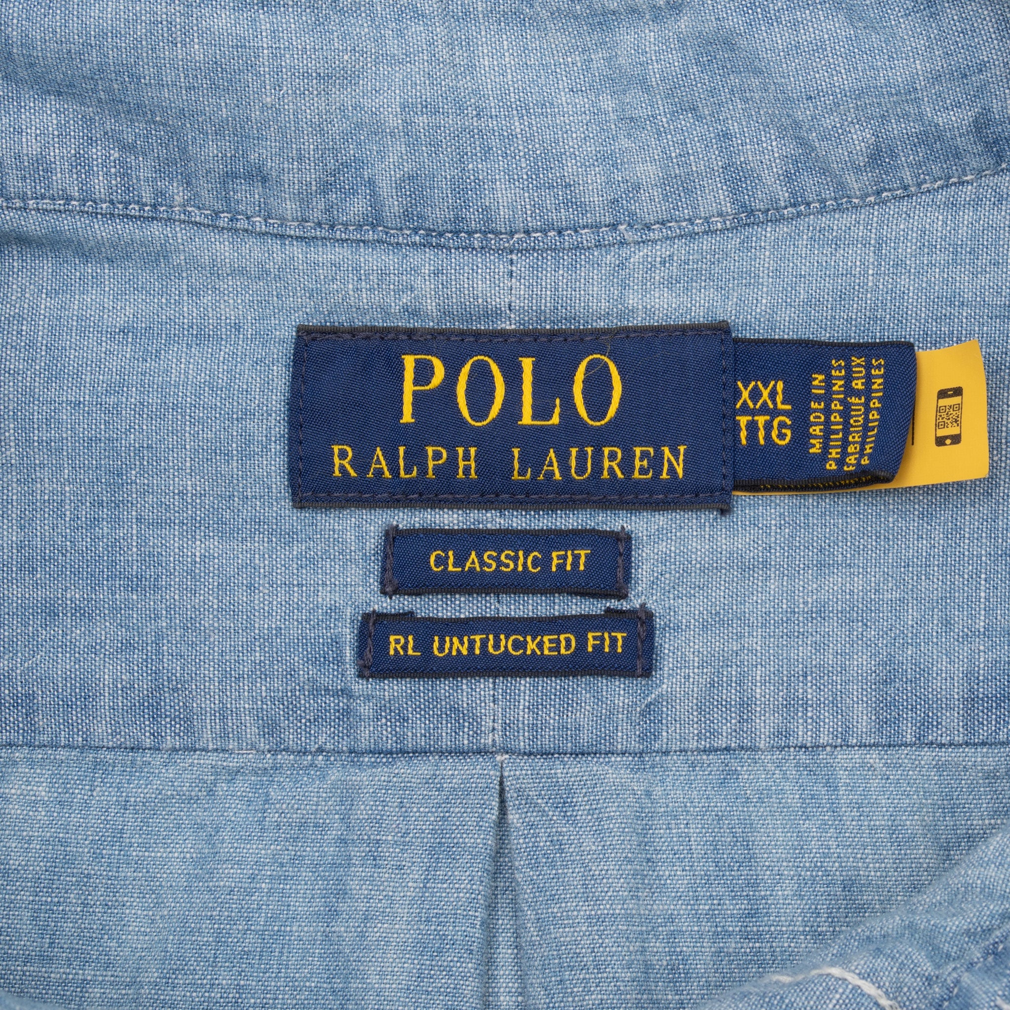 Polo Ralph Lauren XXL Classic Fit and RL Untucked Fit neck labels on blue chambray shirt