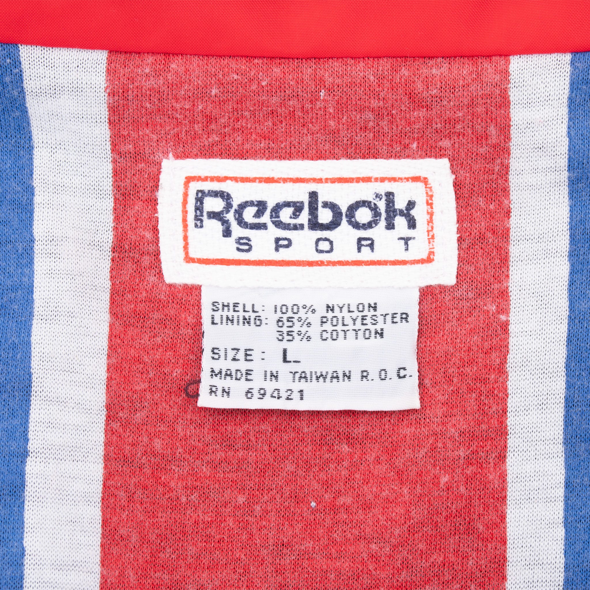 Reebok Sport interior label with size L and shell and lining details