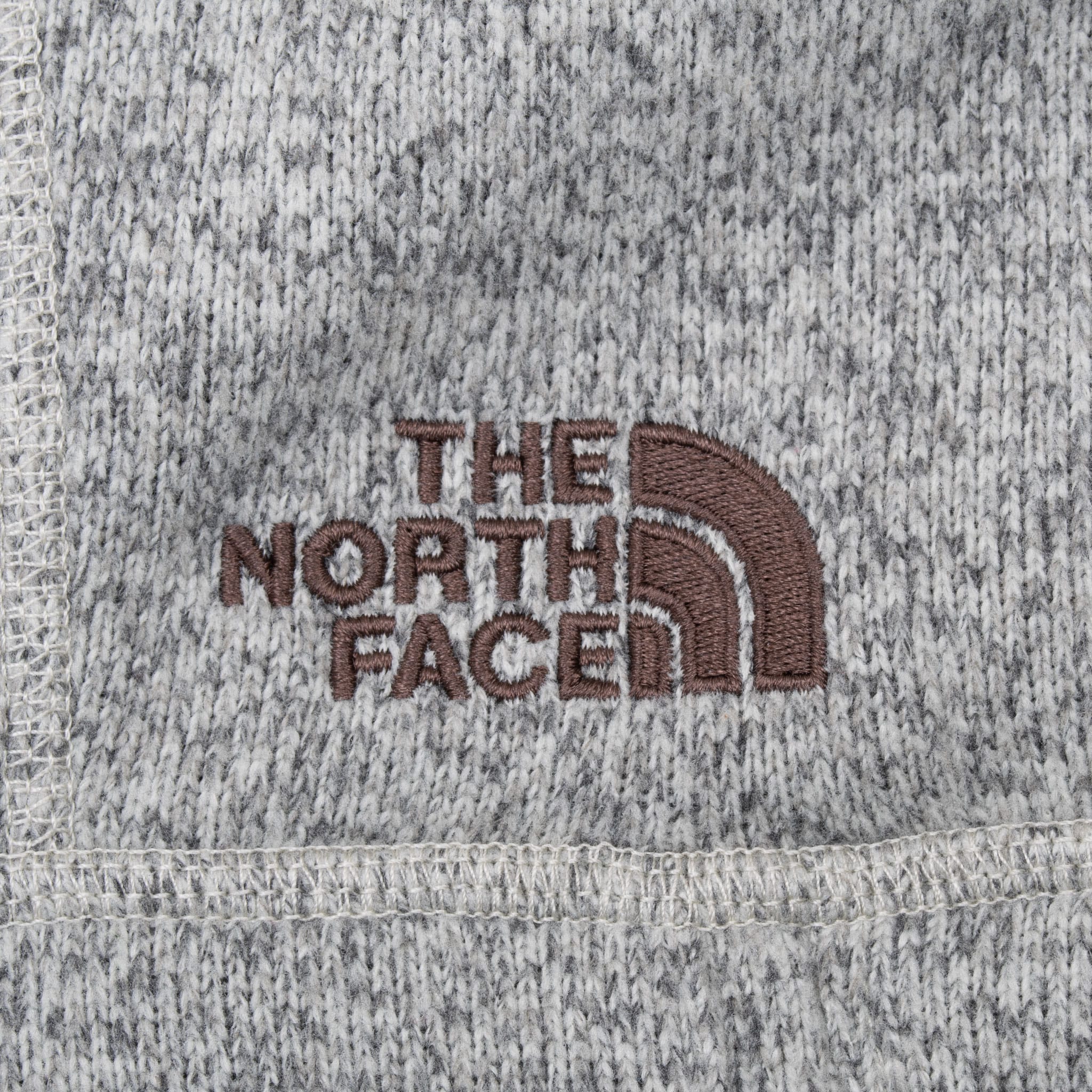 Brown embroidered The North Face chest logo on grey knit fabric