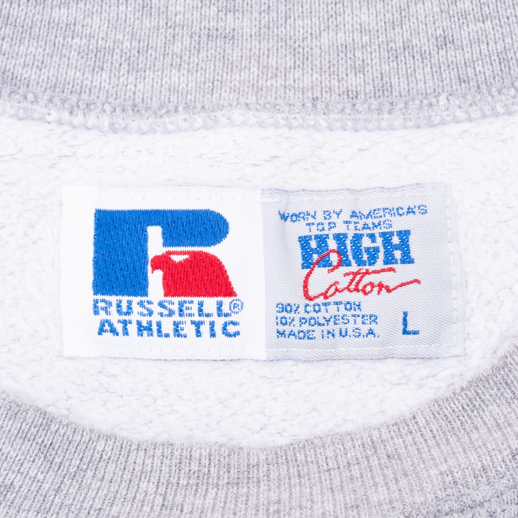 Russell Athletic neck tag on grey sweatshirt showing size large and Made in USA