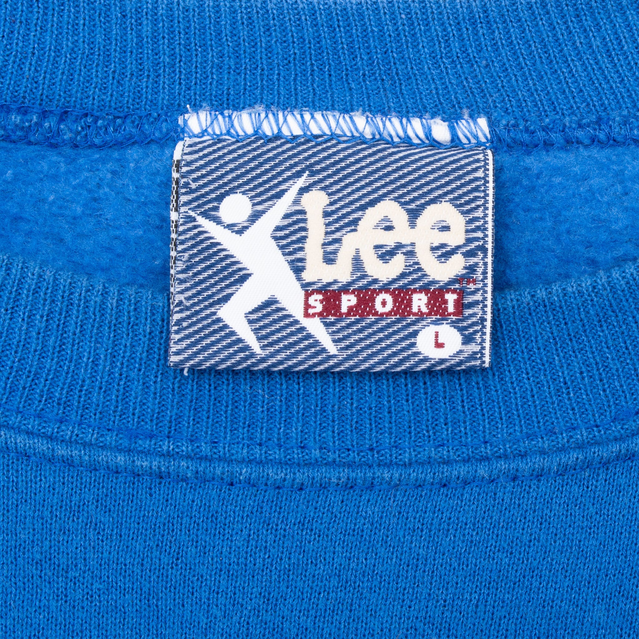 Close-up of Lee Sport neck label inside blue Buffalo Bills sweatshirt