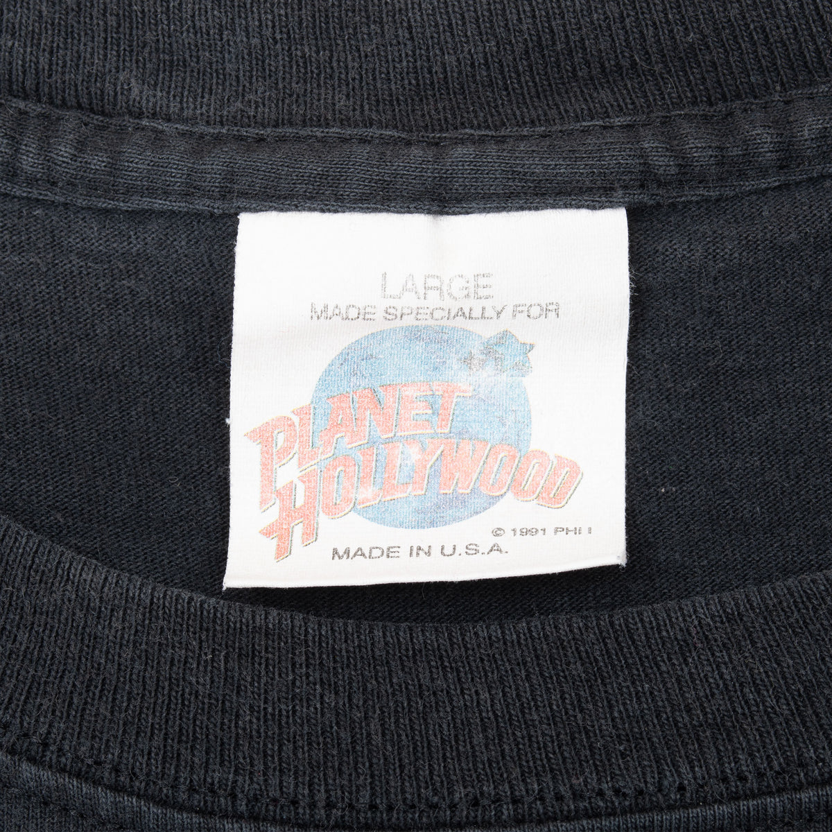 Planet Hollywood neck tag marked large, made in USA