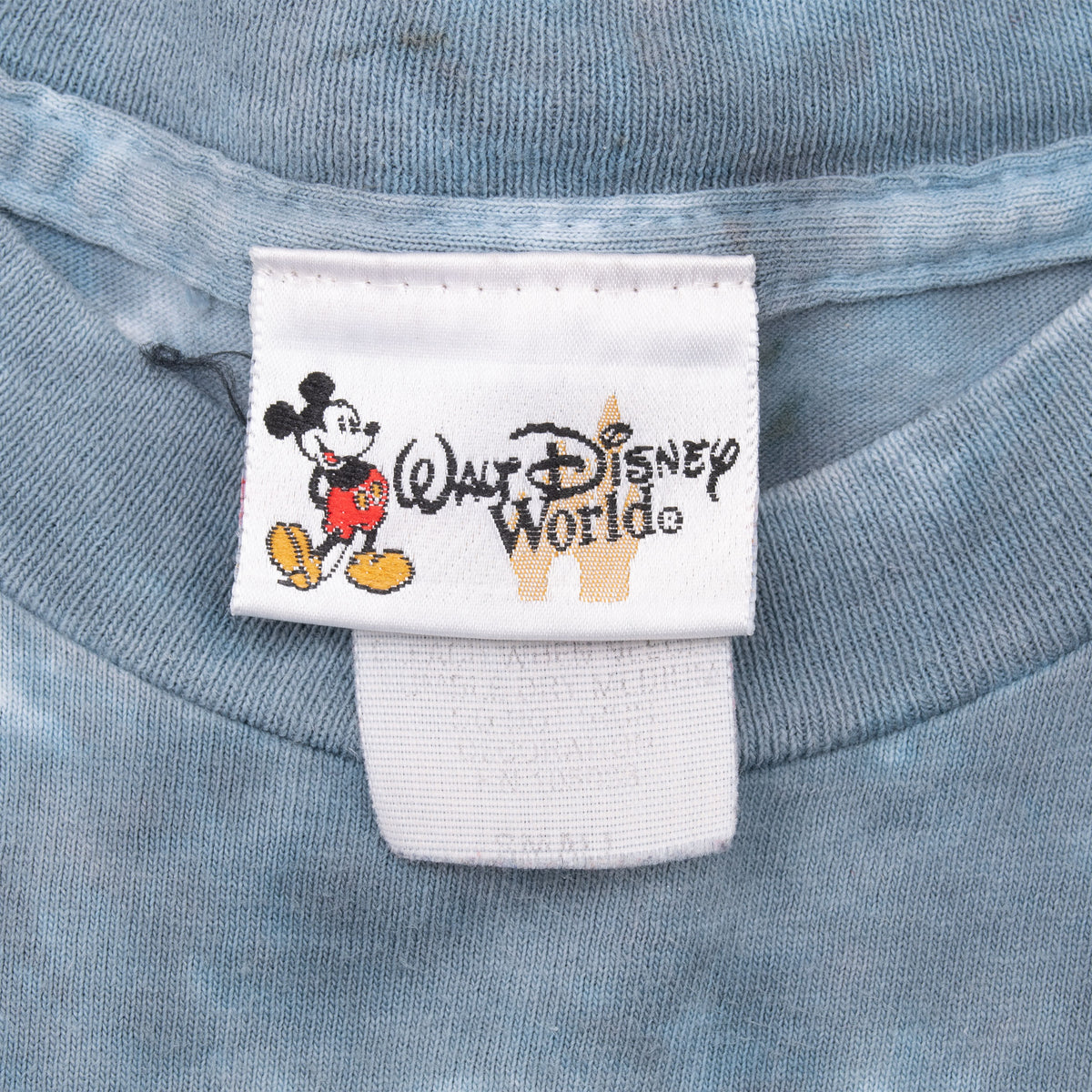 Walt Disney World neck tag with Mickey Mouse on gray T-shirt