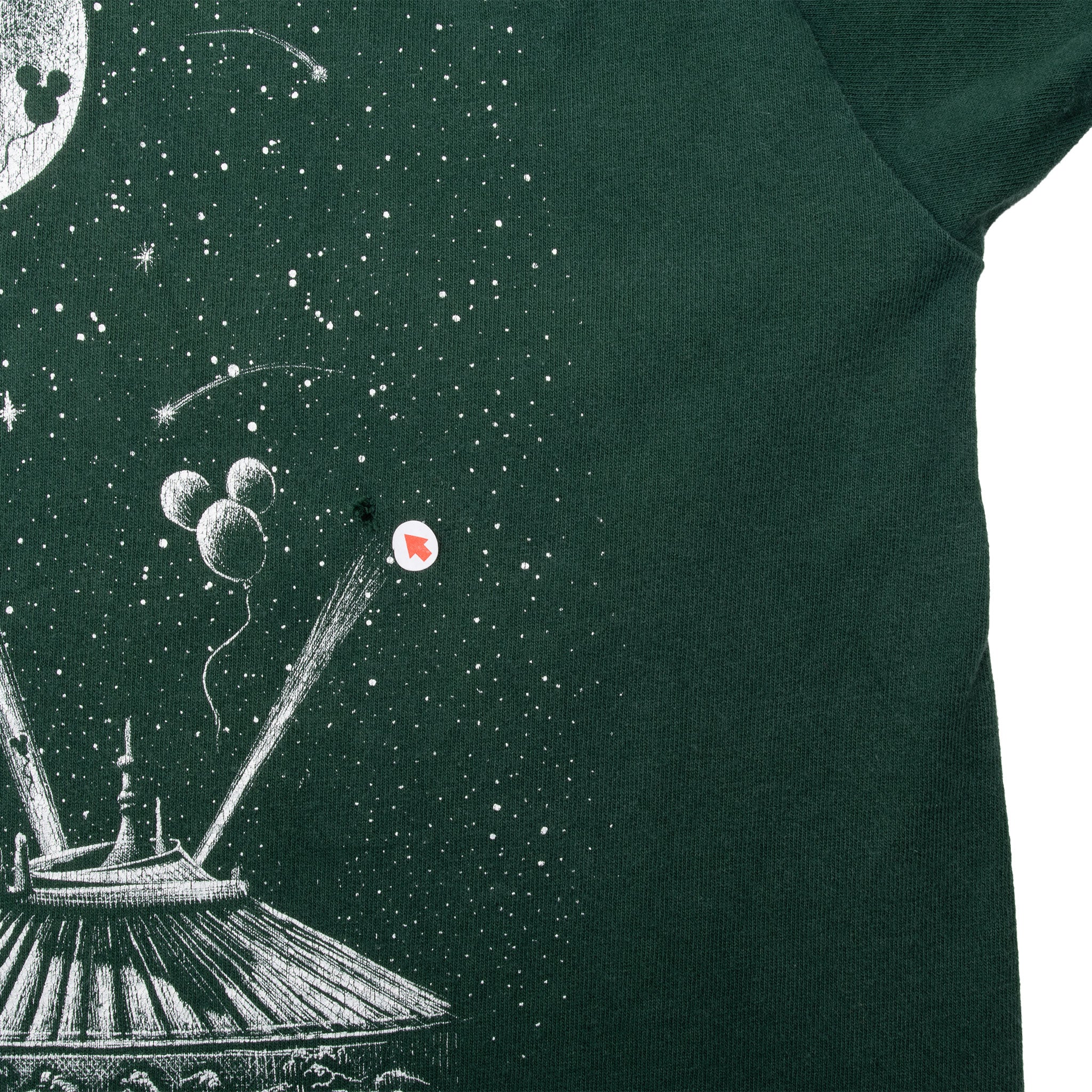 Front graphic detail showing a small hole near the balloon print