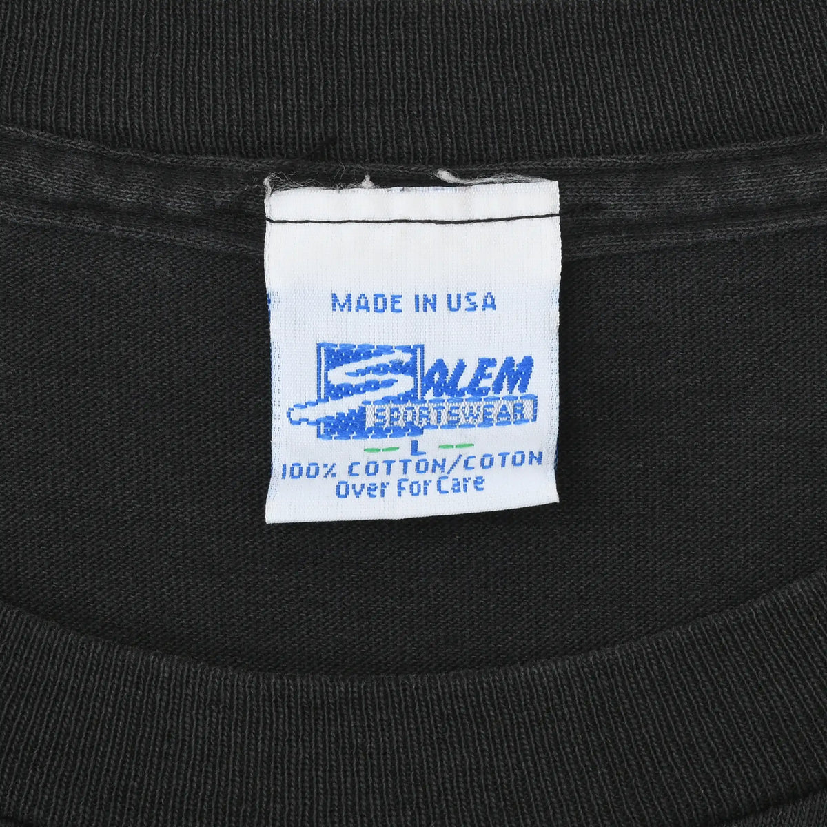 Salem Sportswear neck label on black T-shirt showing Made in USA and 100% cotton