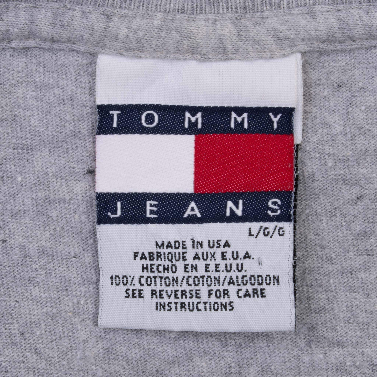 Close-up of Tommy Jeans neck label on grey T-shirt