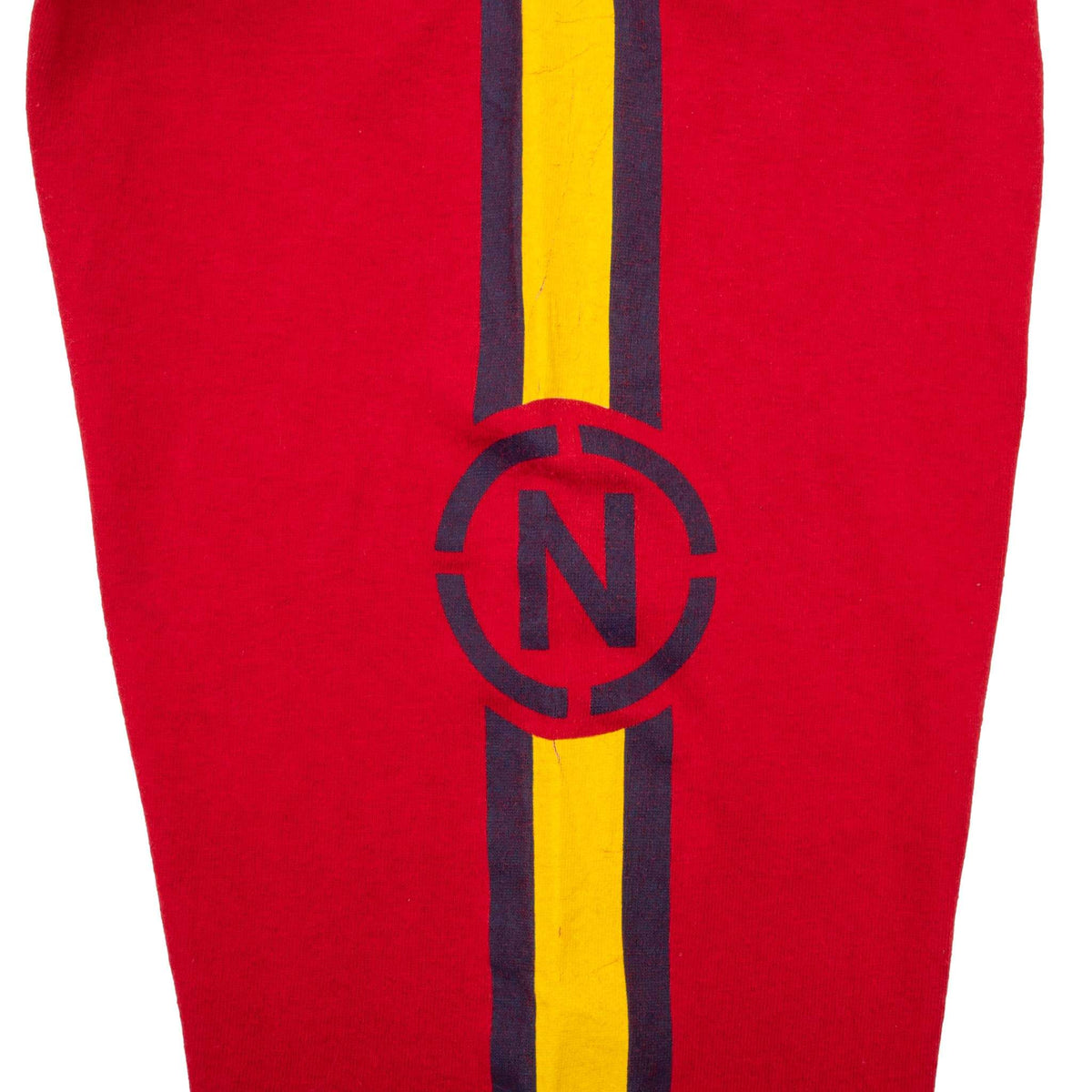 Close-up of navy and yellow striped Nautica logo print on red sleeve