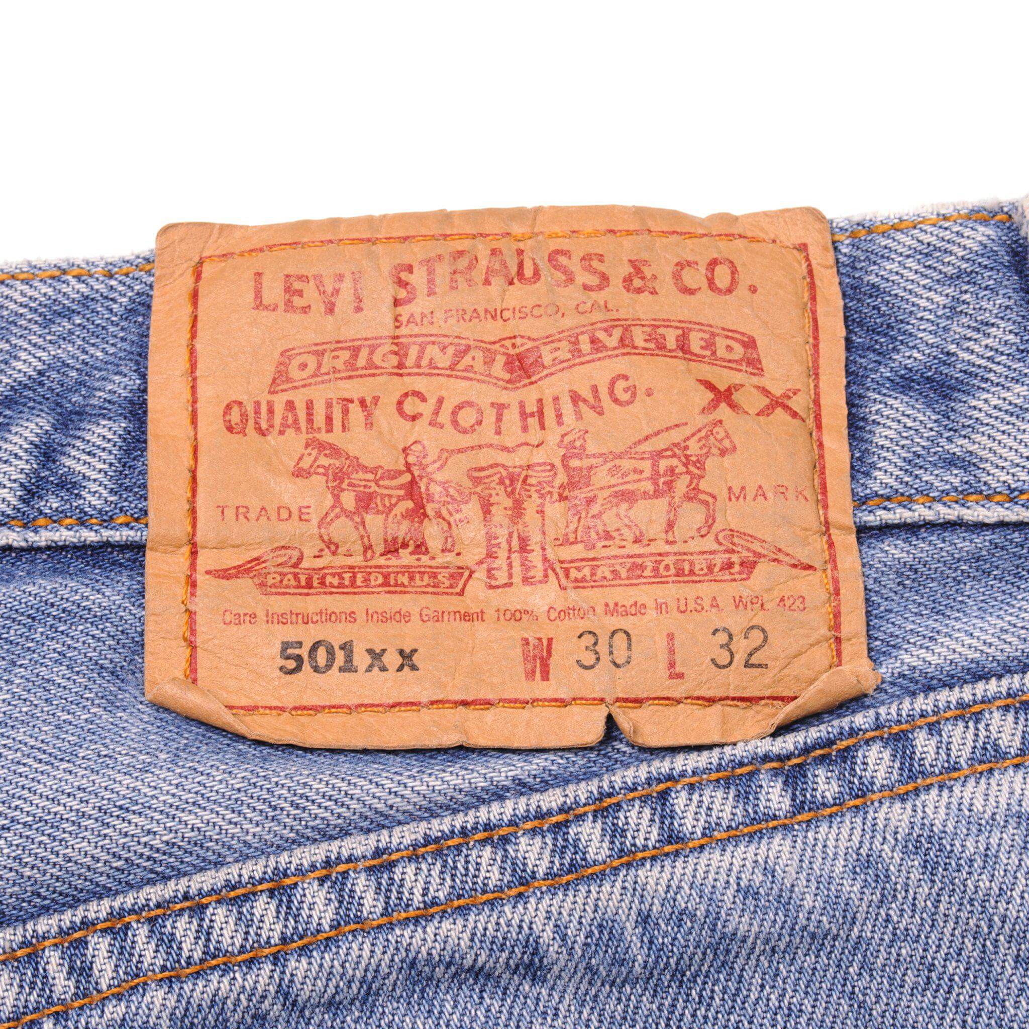 Beautiful Indigo Levis 501 Jeans 1990s Made in USA with a light blue wash and some nice light whiskers. Size on Tag 30X32 ACTUAL SIZE 28X28 Back Button #555