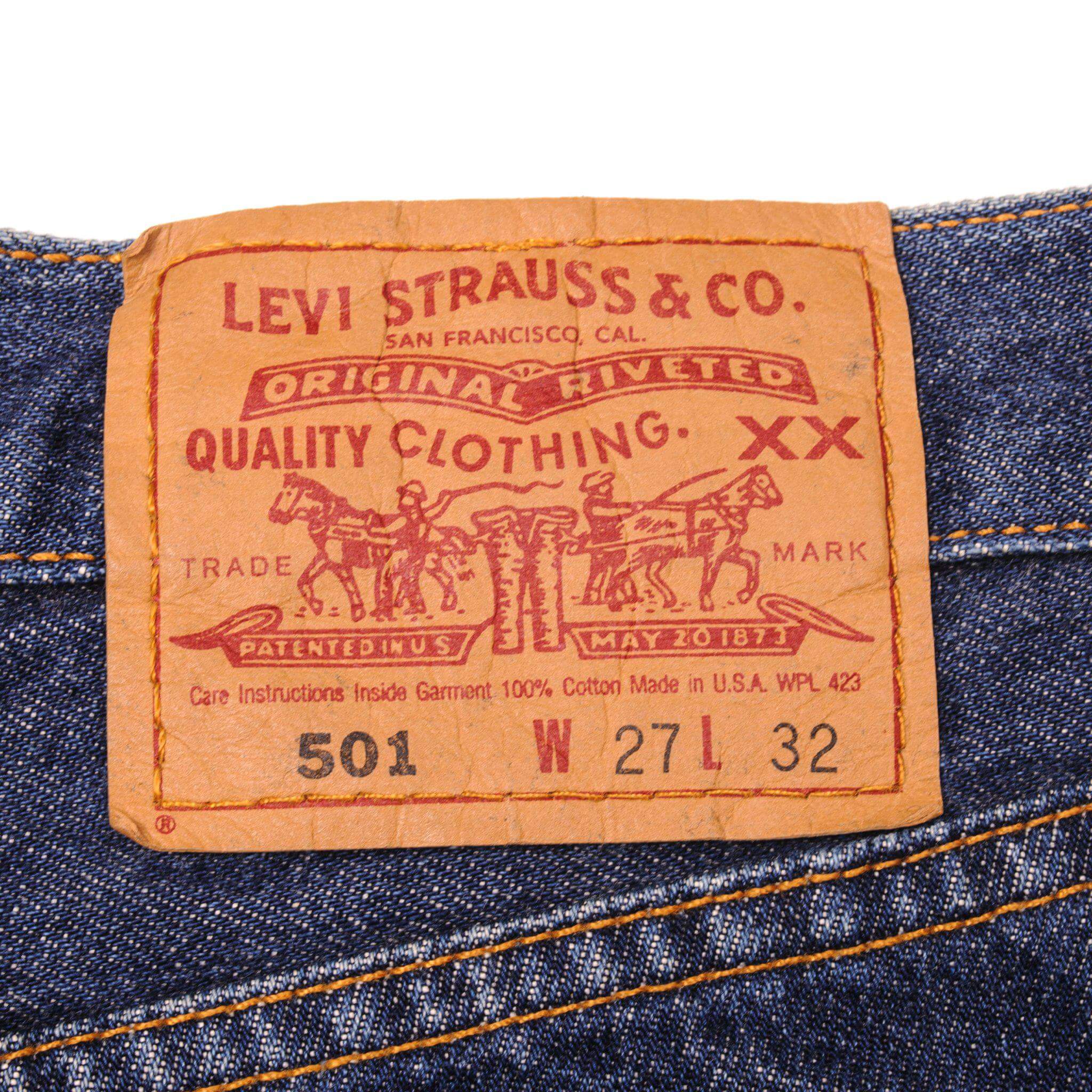 Beautiful Indigo Levis 501 Jeans Made in USA with a very dark wash . Size on Tag 27X32 ACTUAL SIZE 27X28 Back Button #553
