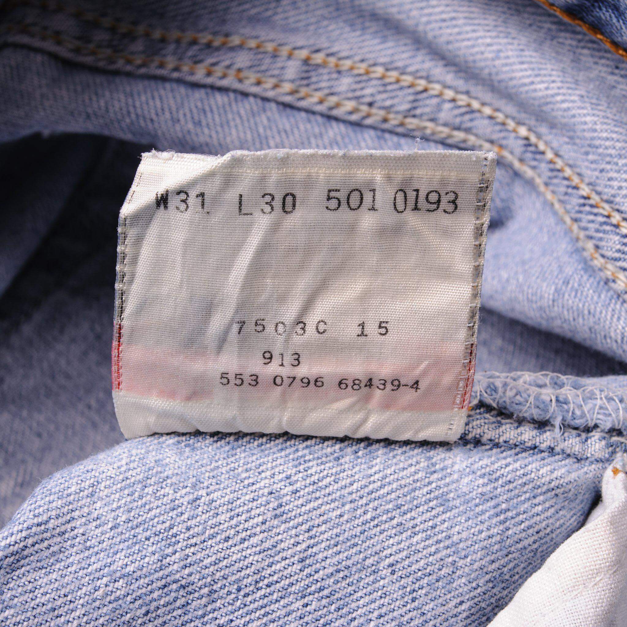 Beautiful Indigo Levis 501 Jeans 1990s Made in USA with a light blue wash. Size on Tag 31X30 ACTUAL SIZE 31X29 Back Button #553