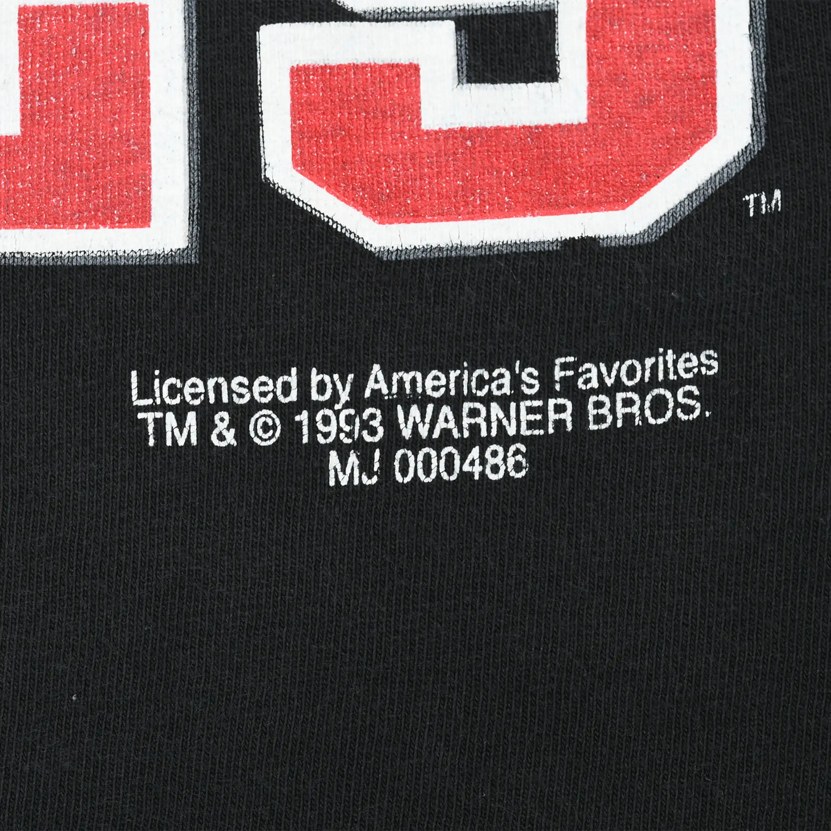 Close-up of 1993 Warner Bros. licensing print beneath Chicago Bulls graphic