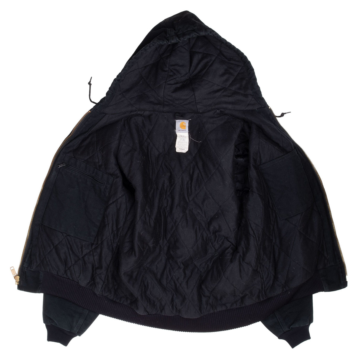 Open black Carhartt J140 hooded active jacket showing quilted interior lining and inner pocket