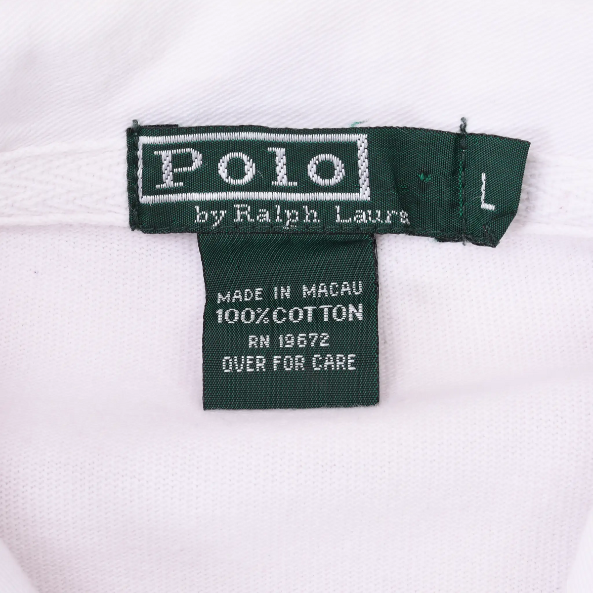 Close-up of green Polo by Ralph Lauren neck, size and care labels inside white collar