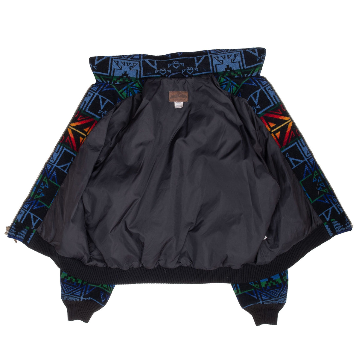 Pendleton jacket opened to show dark interior lining and multicolor patterned outer fabric