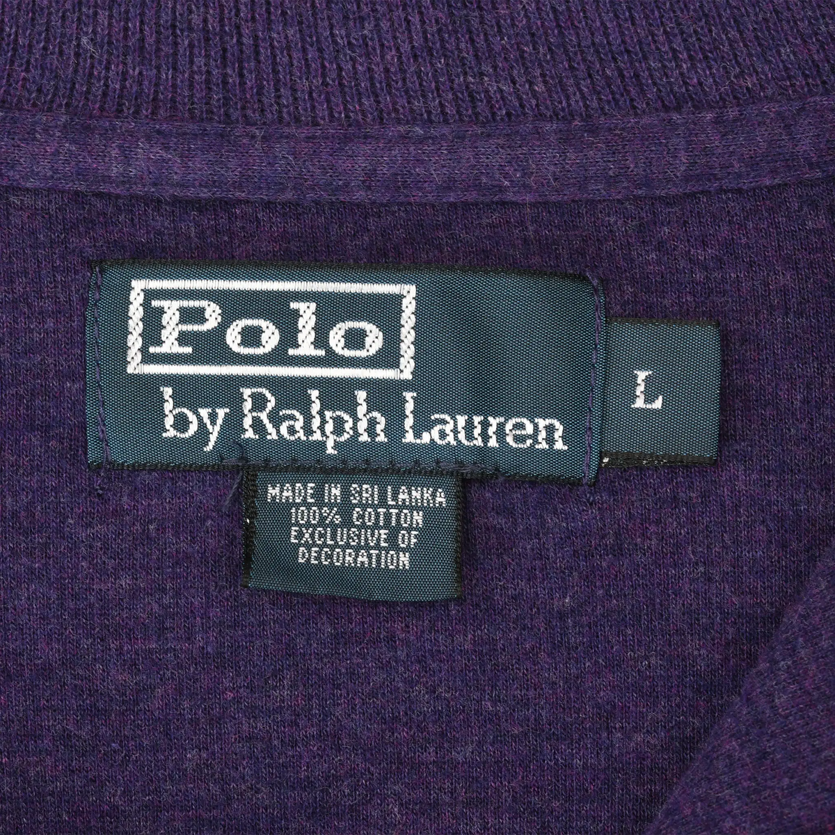 Close-up of Polo by Ralph Lauren neck label and size L tag inside purple sweater