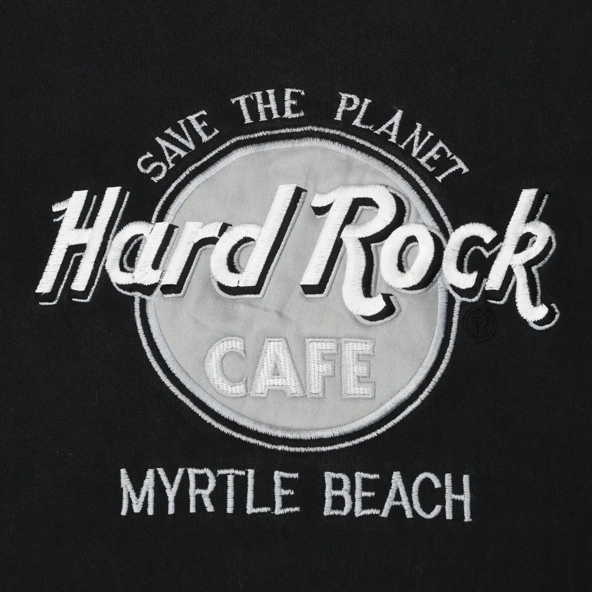 Close-up of white Save the Planet Hard Rock Cafe Myrtle Beach chest graphic