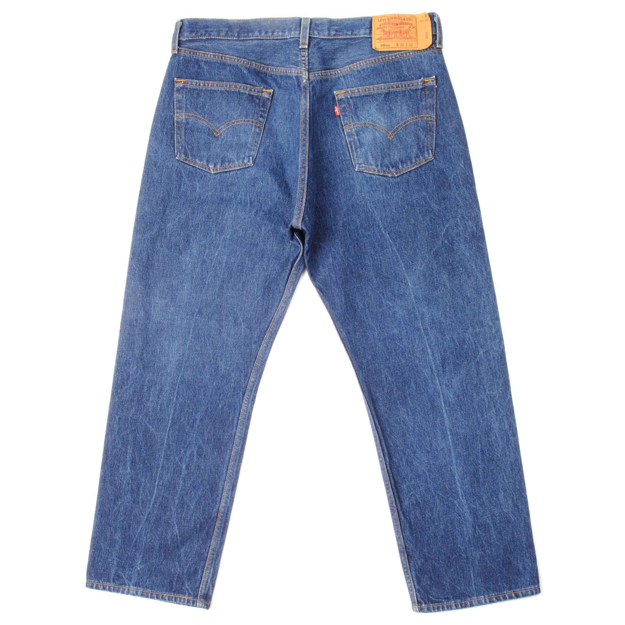 Beautiful Indigo Levis 501 Jeans from the 90's Made in USA with a medium blue wash. Size 36x27 Back Button #553