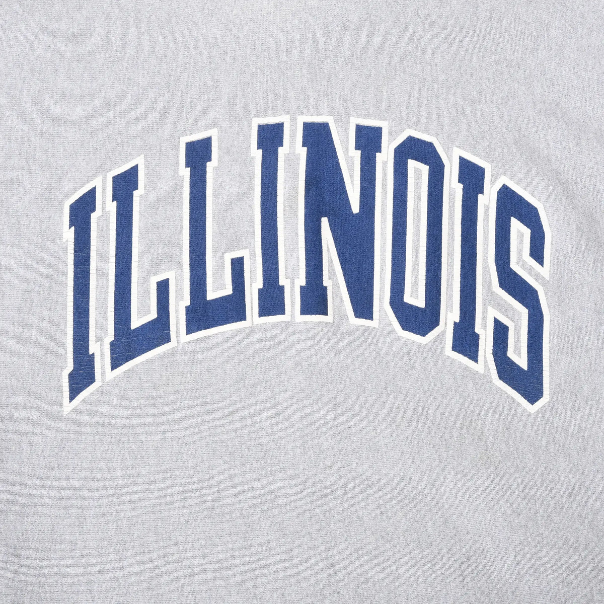 Close-up of navy and white arched Illinois chest print on gray sweatshirt