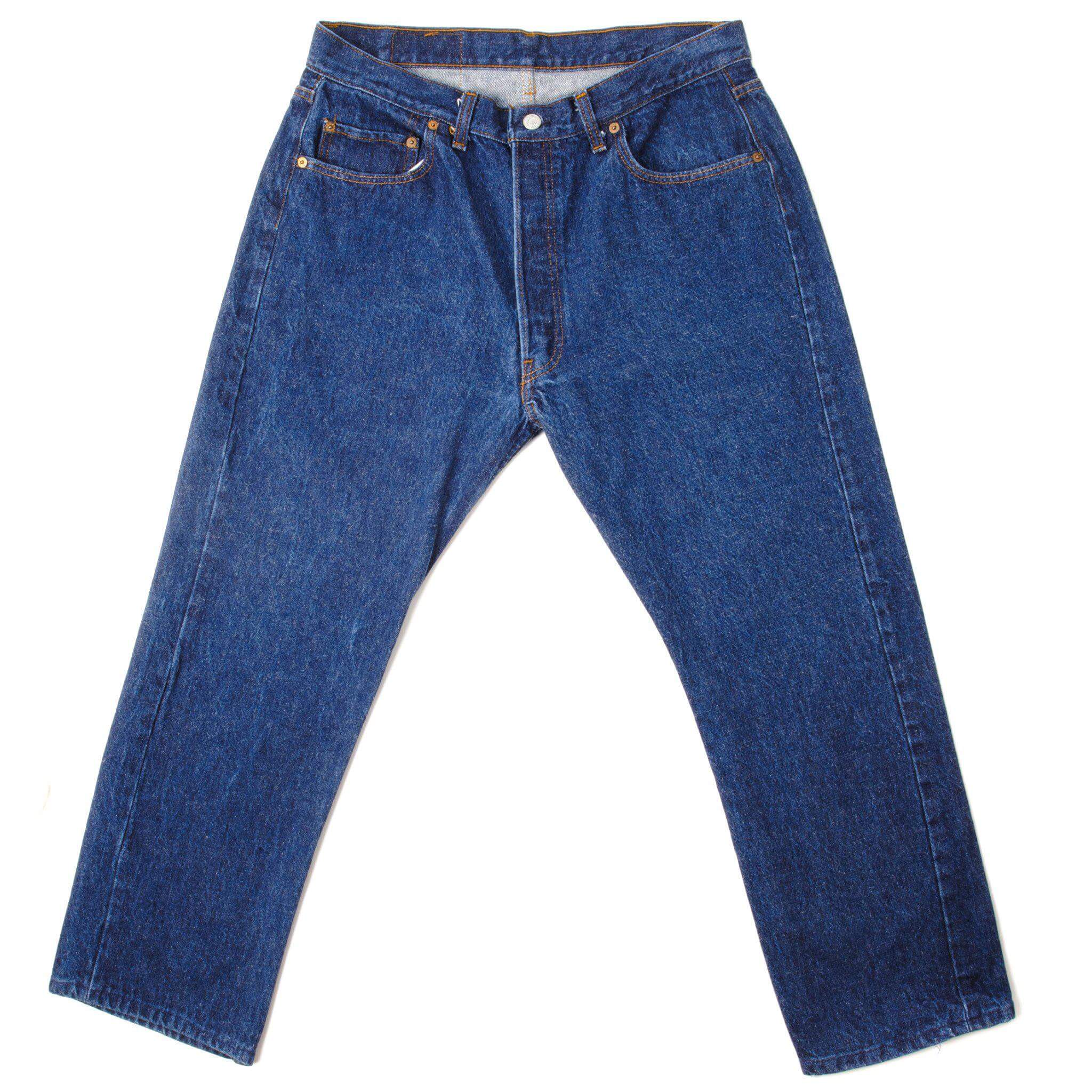 Exceptional Indigo Levis 501 Jeans from 1985 to 1988 Made in USA with a dark blue wash. One time washed. Size 34x26 Back Button #653