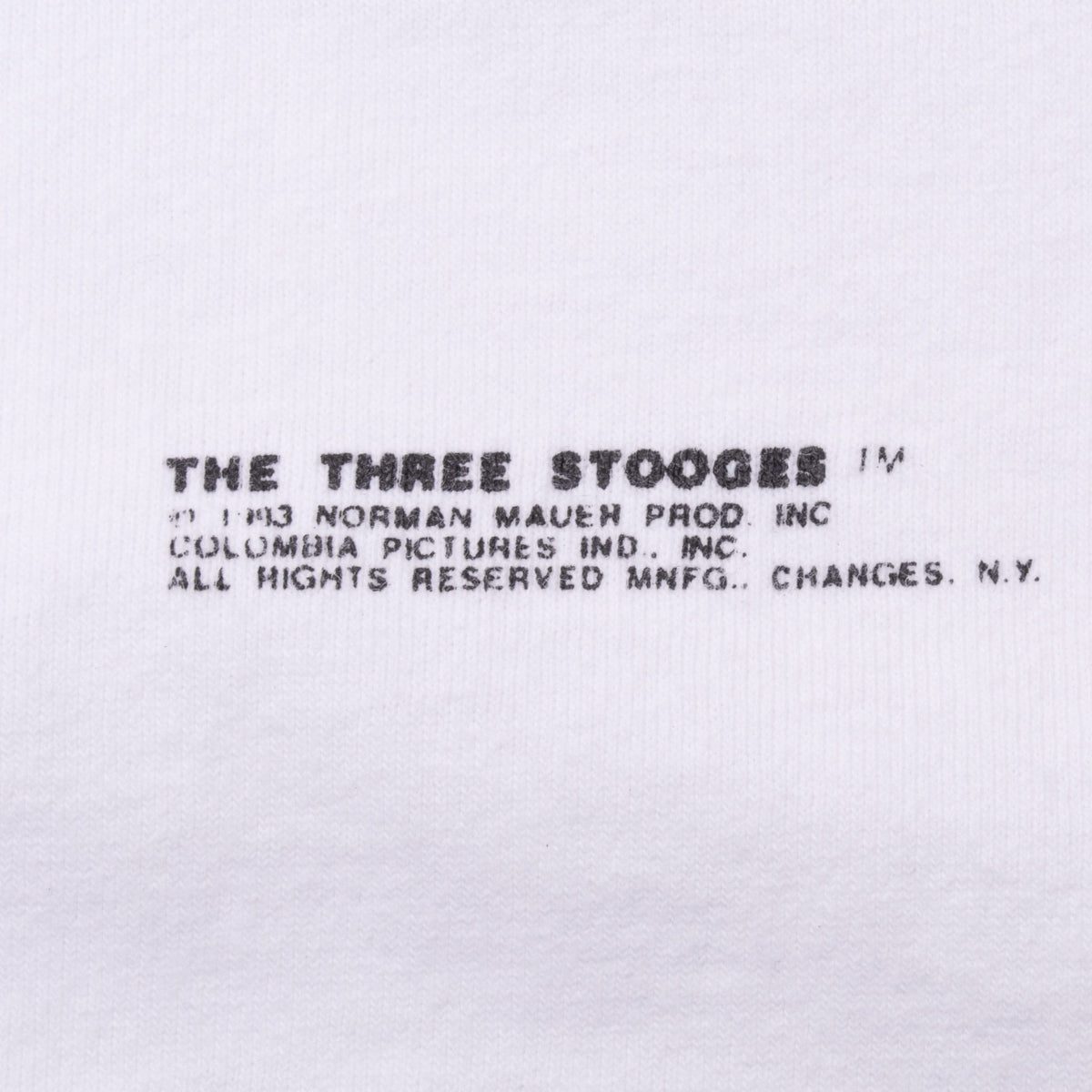 Close-up of The Three Stooges 1993 copyright text beneath the front graphic
