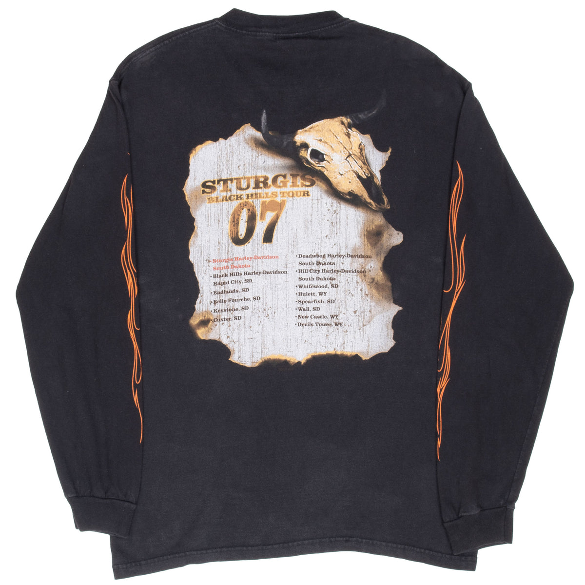 Back of black Harley-Davidson Sturgis 2007 tee with Black Hills tour stops, skull, and sleeve flames