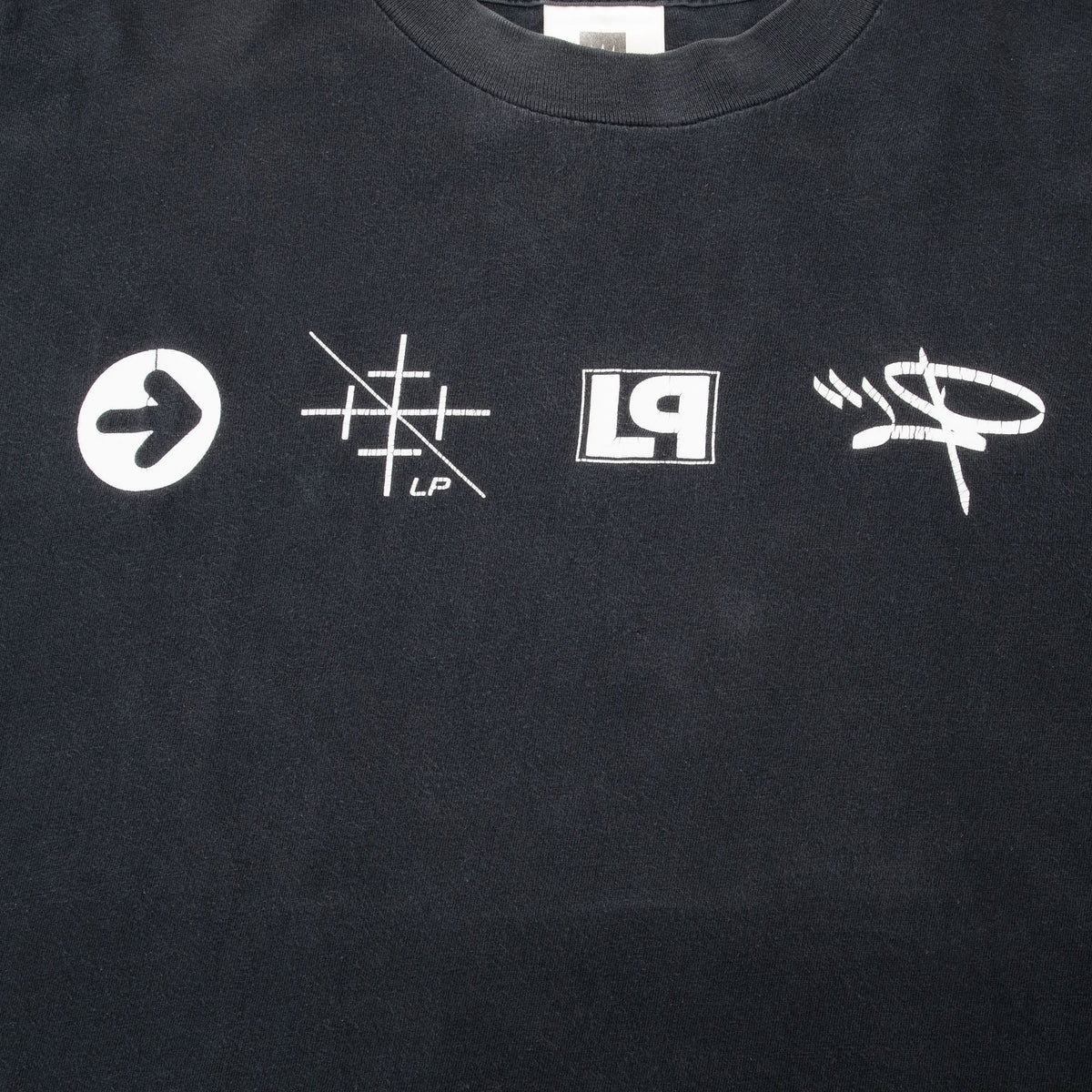 Close-up of four white Linkin Park symbols printed across the chest