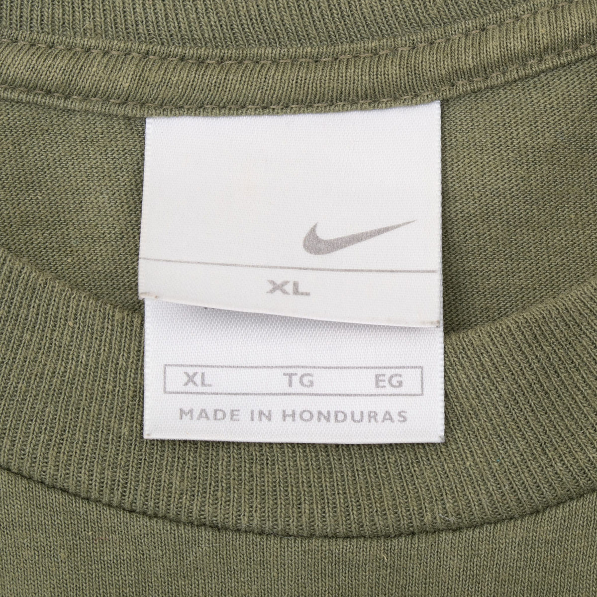 Nike Swoosh neck tag marked XL inside olive green ribbed collar