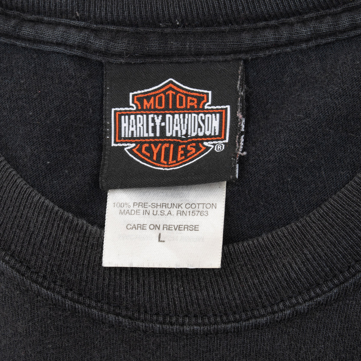 Harley-Davidson neck tag and size large care label inside black T-shirt