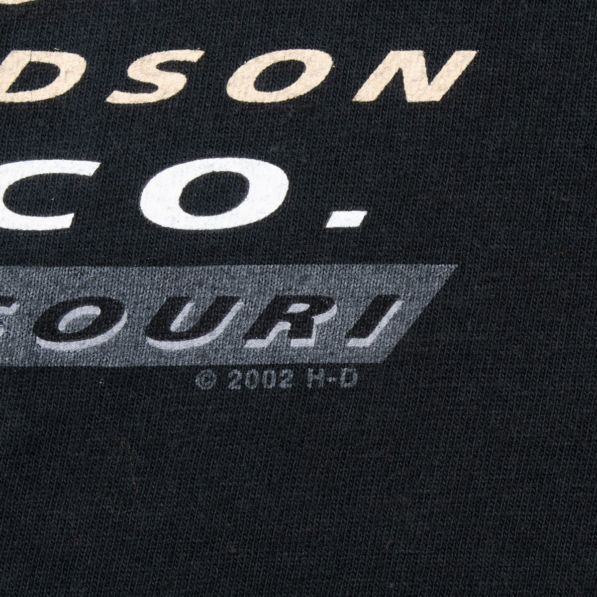 Close-up of the back print showing the 2002 Harley-Davidson copyright mark