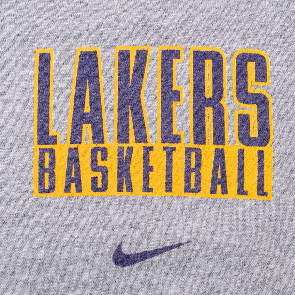 Close-up of purple and gold Lakers Basketball chest print with Nike Swoosh