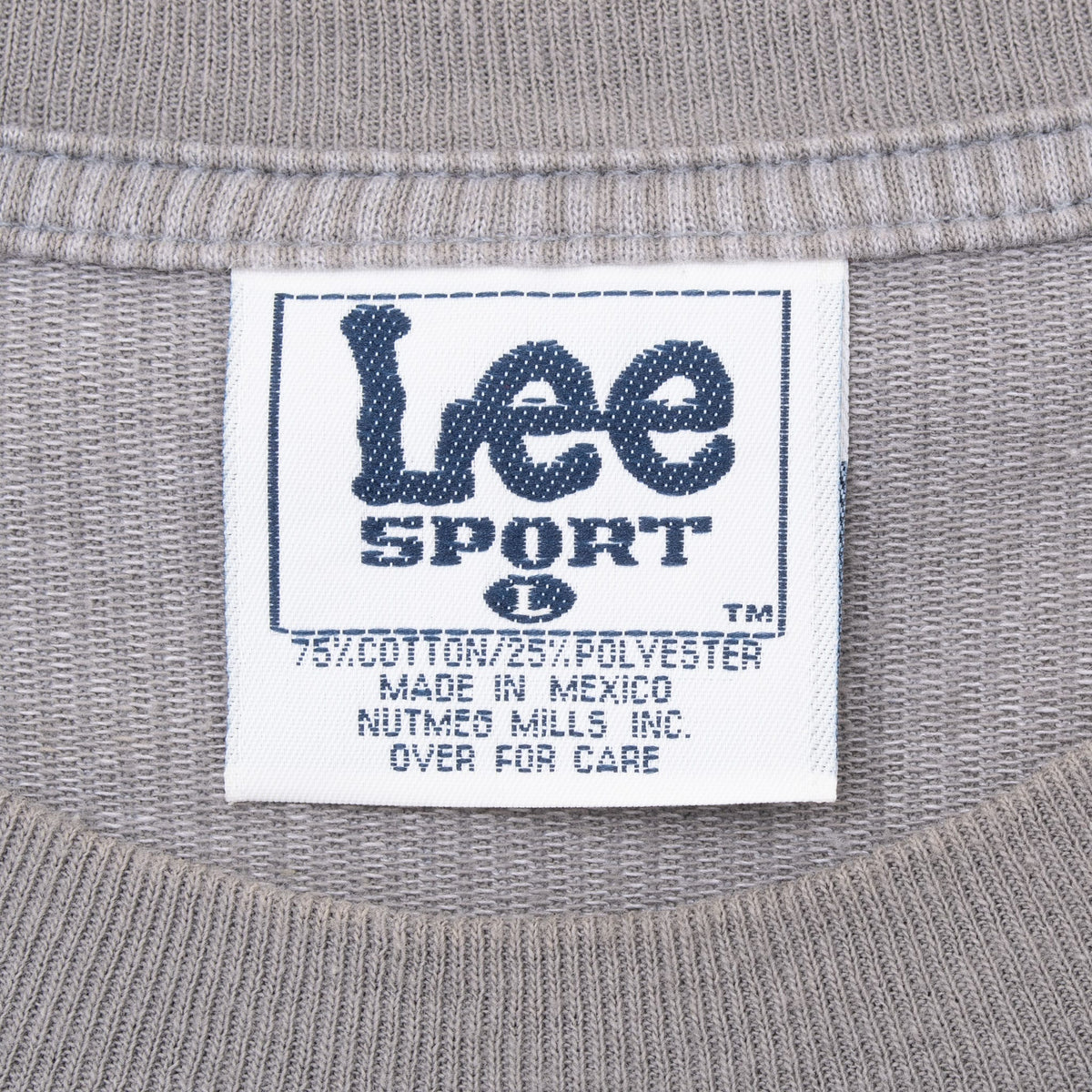 Close-up of Lee Sport neckline label on gray St. Louis Cardinals T-shirt