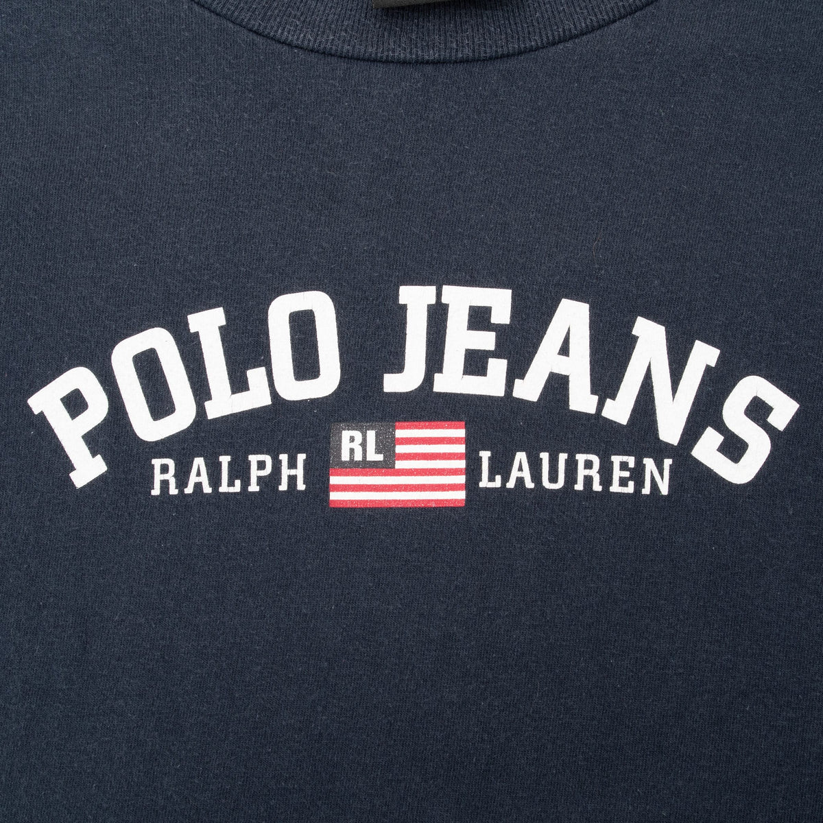 Close-up of white Polo Jeans Ralph Lauren chest print with red, white and blue RL flag