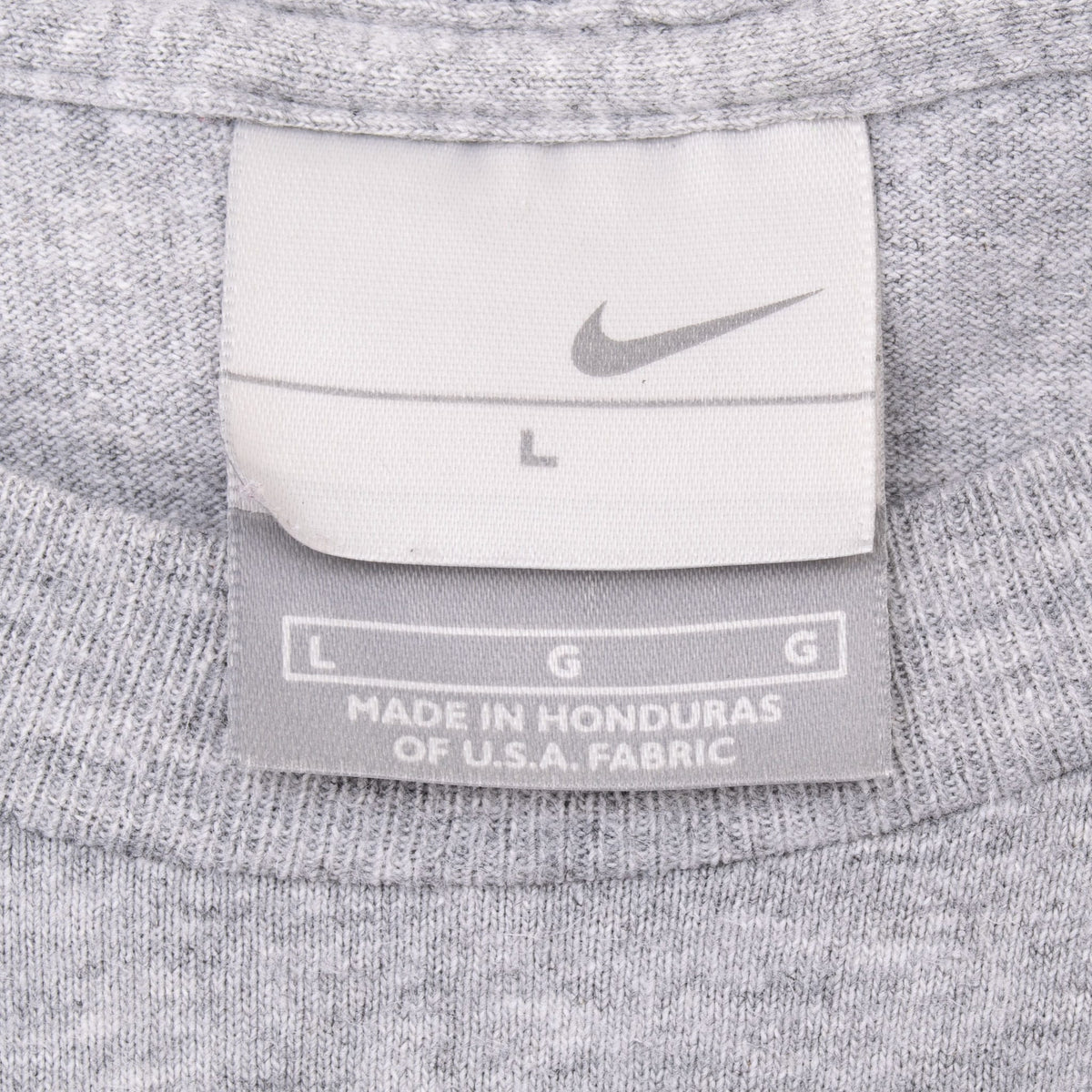 Nike neck tag and size large label inside grey long-sleeve T-shirt