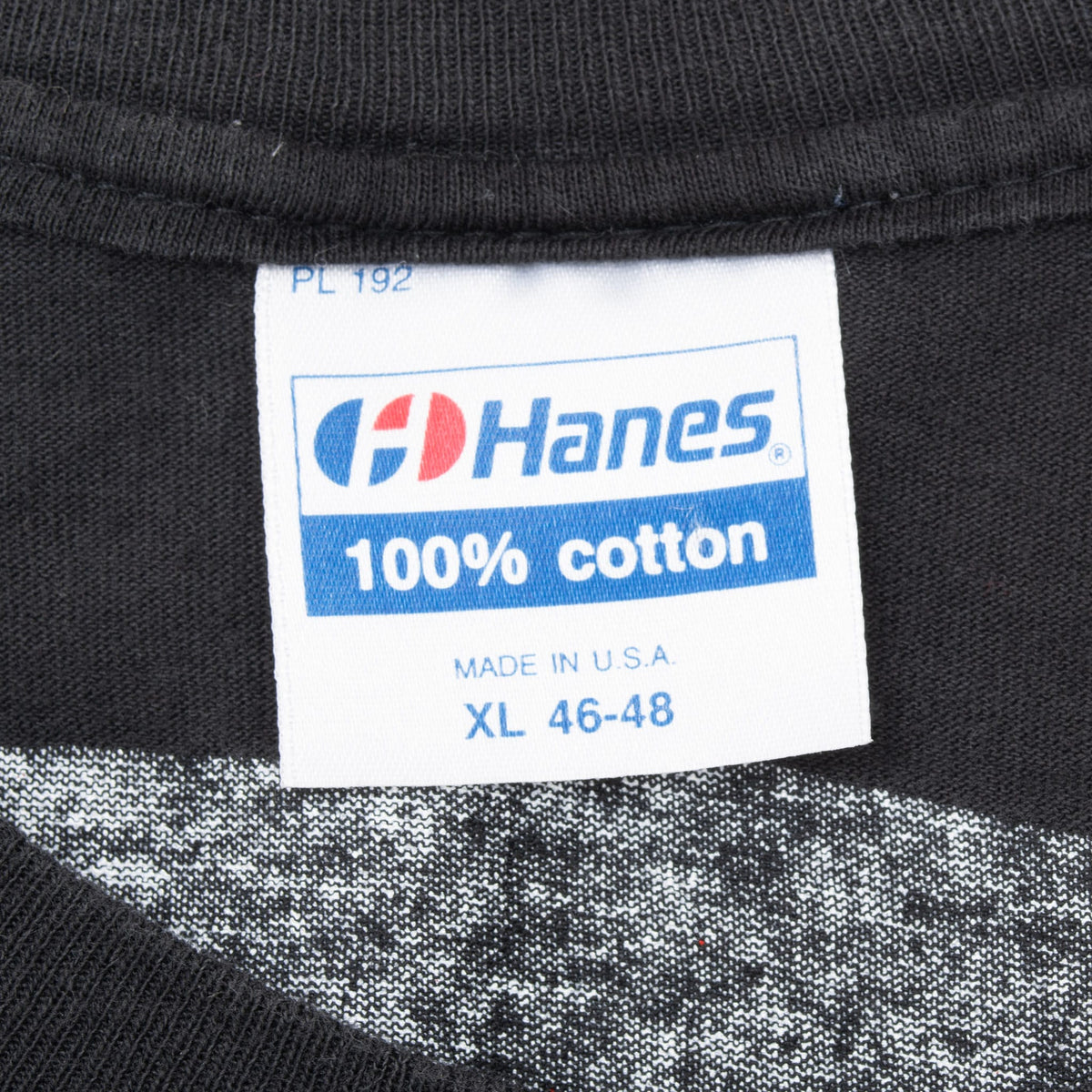 Hanes neck tag marked 100% cotton, made in USA, and XL 46-48