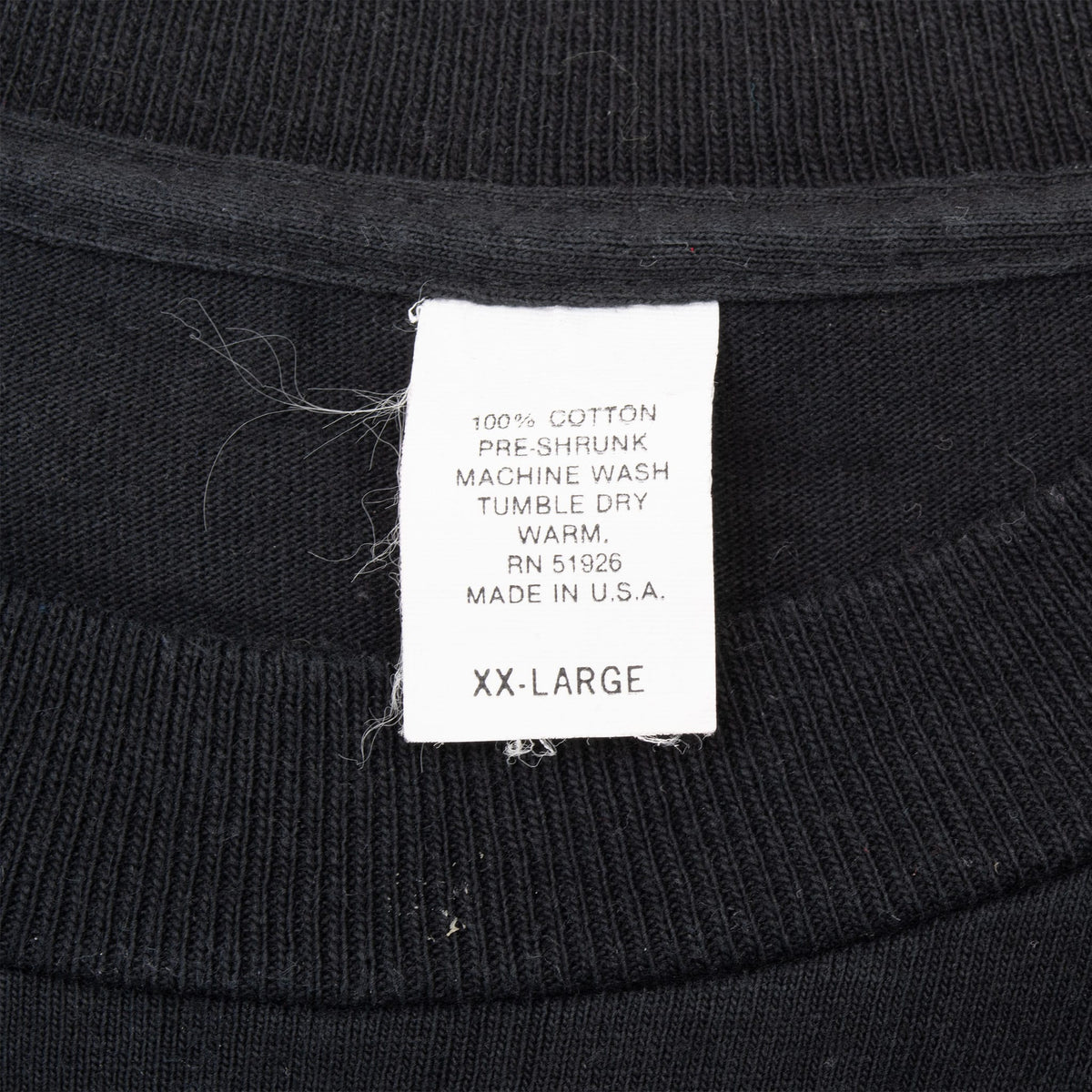 Neck label on Billy Ray Cyrus T-shirt marked XX-Large and Made in USA