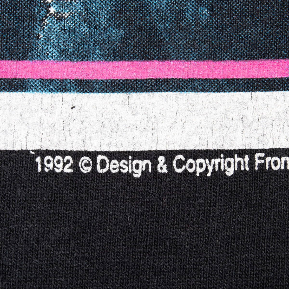 Close-up of 1992 copyright text beneath the front graphic