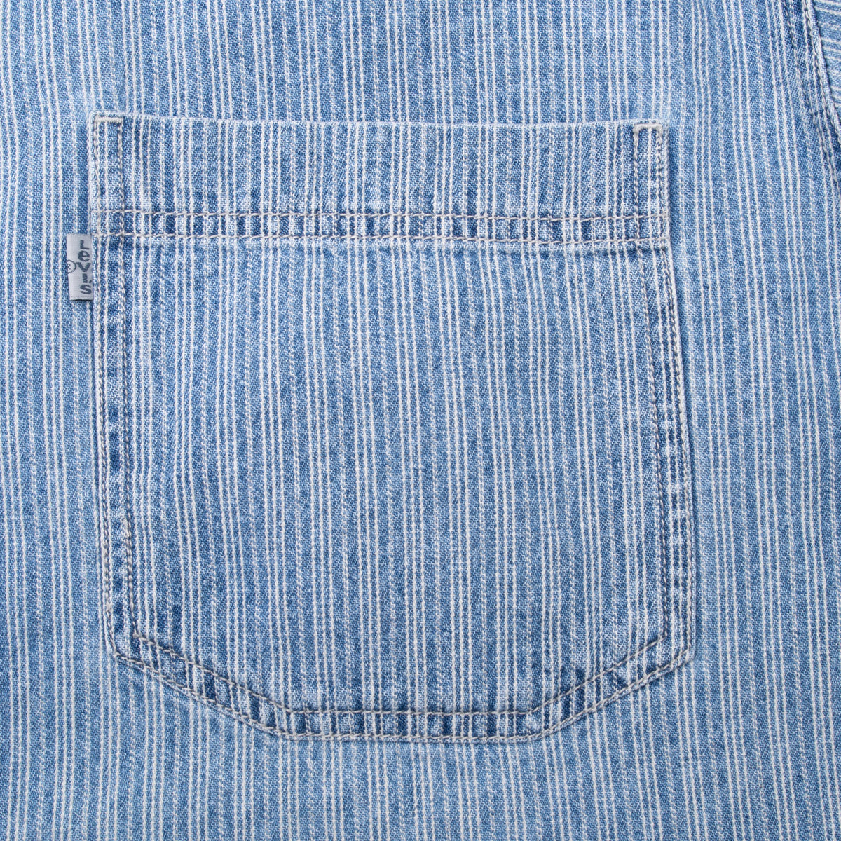 Close-up of chest pocket and grey Levi's tab on blue striped shirt