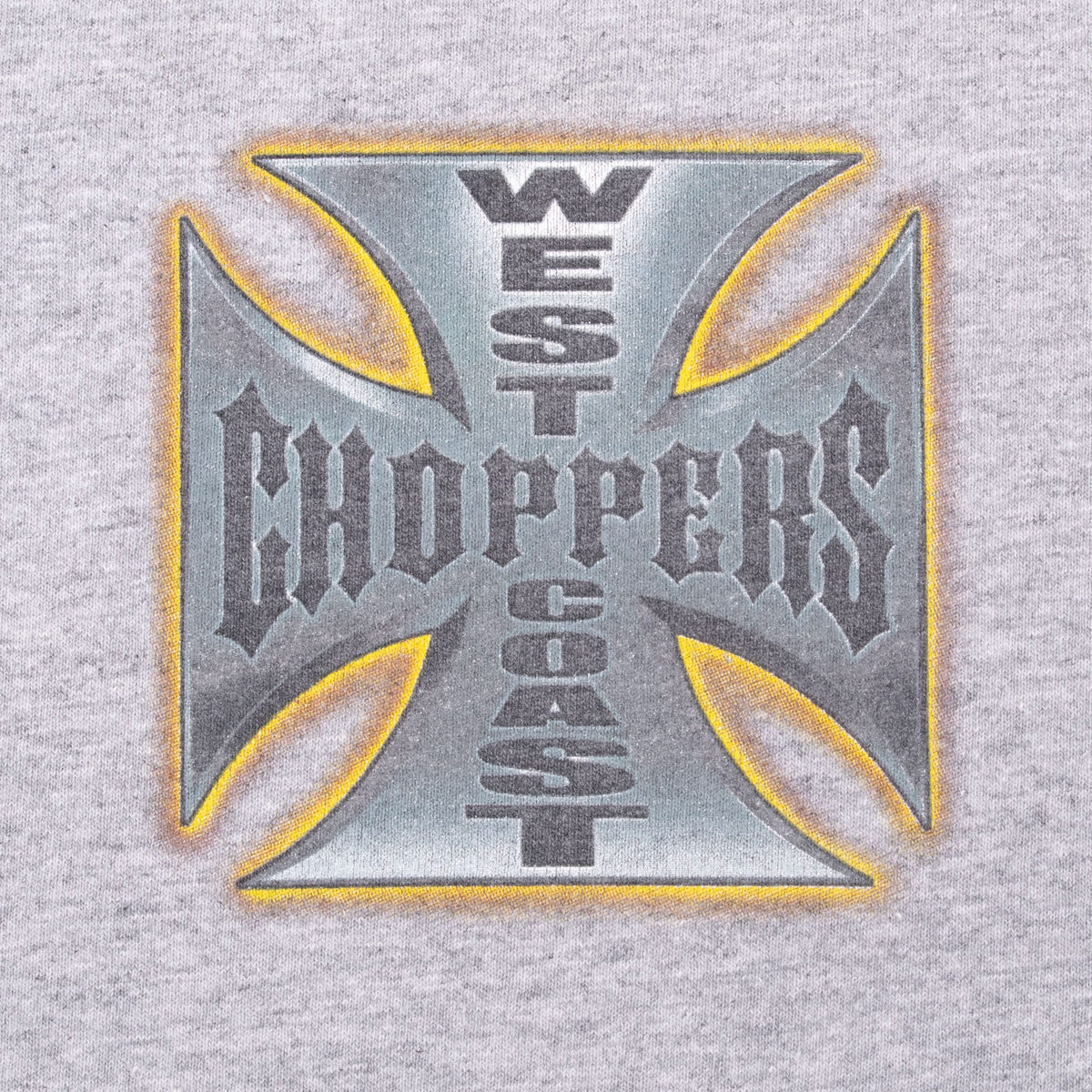 Close-up of gray, black and orange West Coast Choppers cross chest print