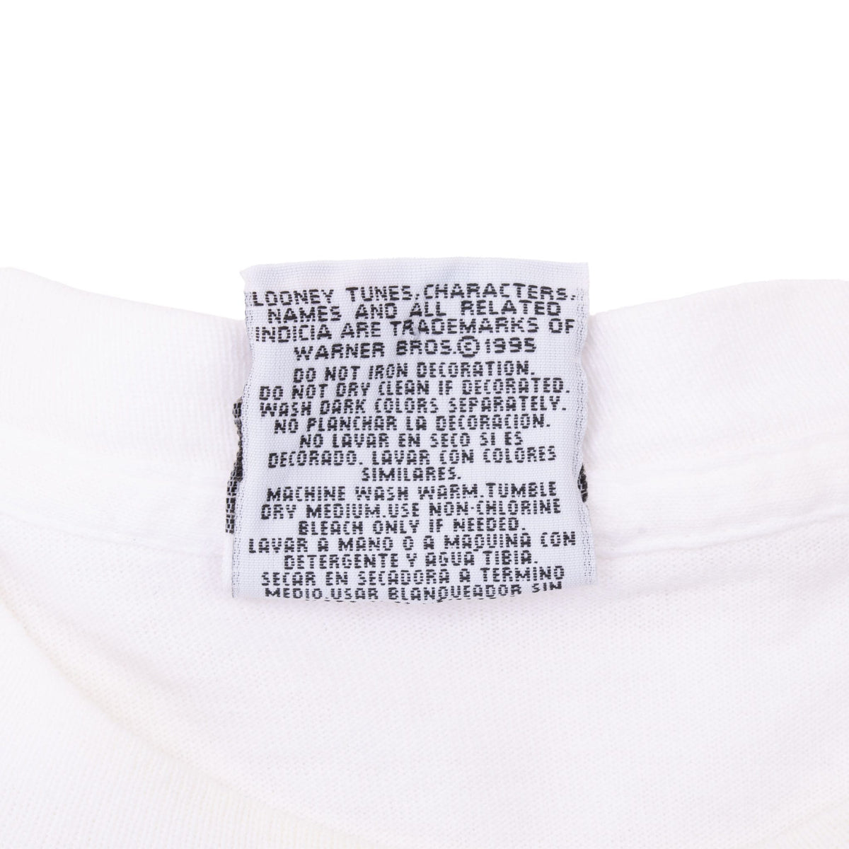 Back of Looney Tunes neck tag with care instructions