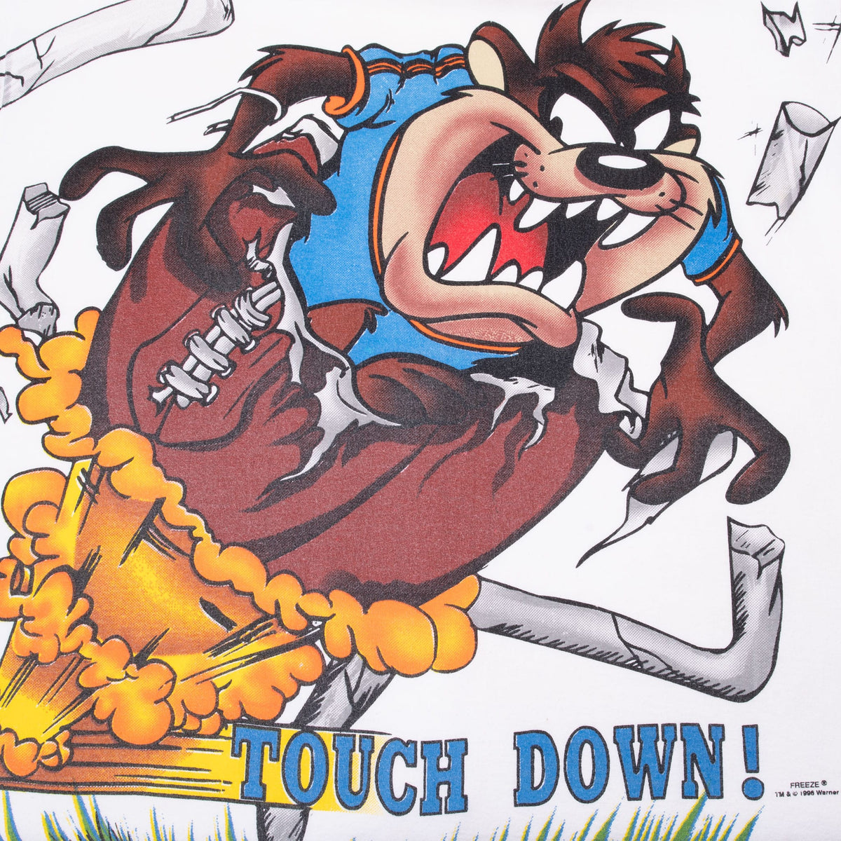 Close-up of Taz charging through a football play above “Touch Down!” text