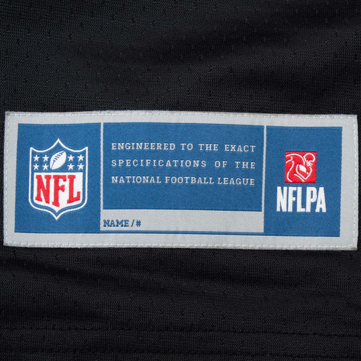 NFL and NFLPA hem label detail on black Pittsburgh Steelers jersey