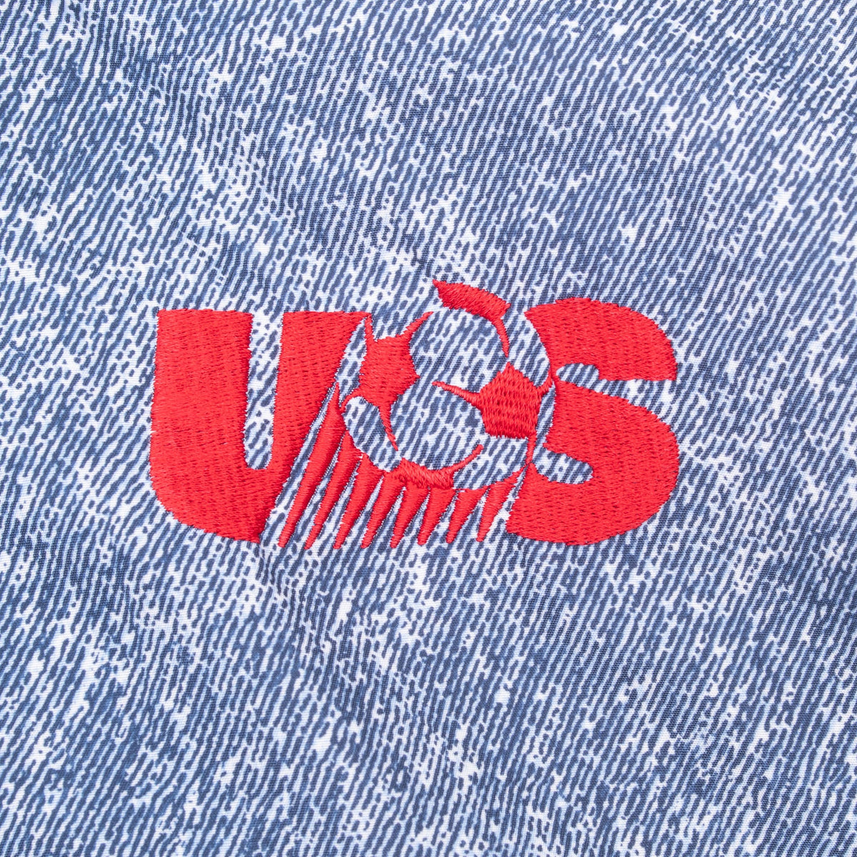 Red US soccer ball logo embroidery on blue patterned chest