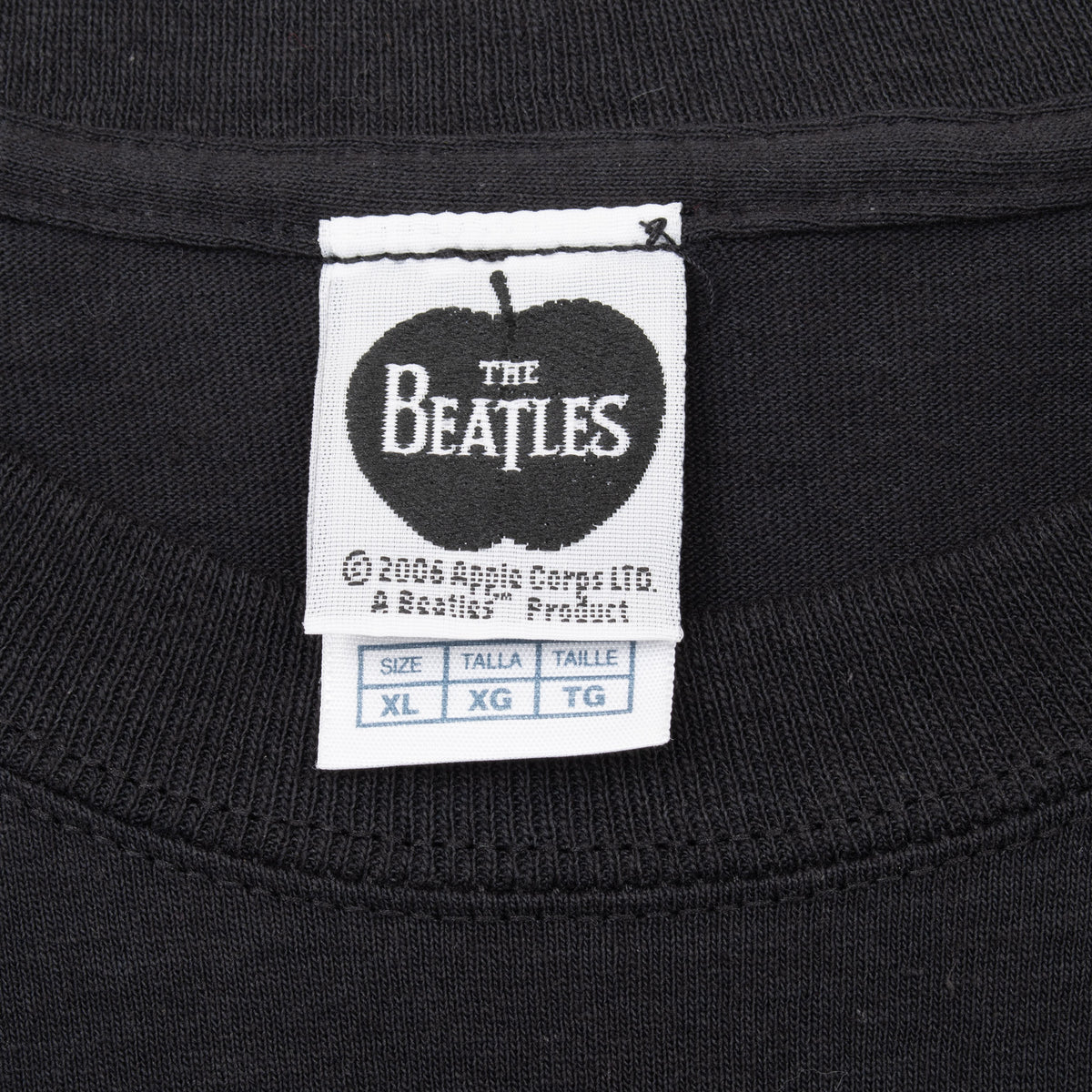 The Beatles Apple neck label and XL size tag inside black T-shirt