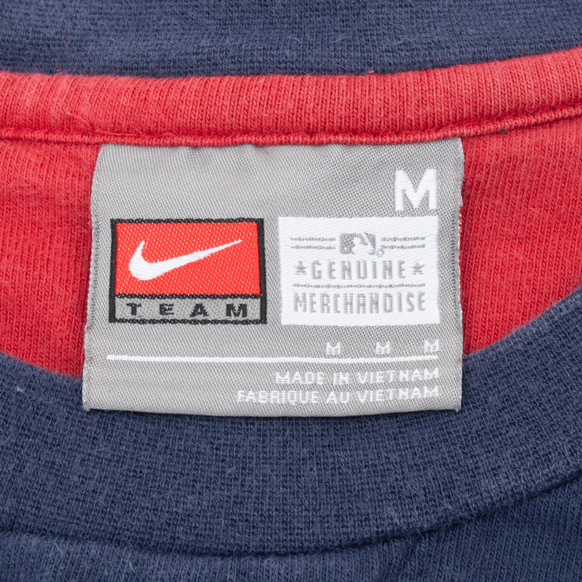Nike Team MLB neck label showing size medium inside the Cardinals shirt