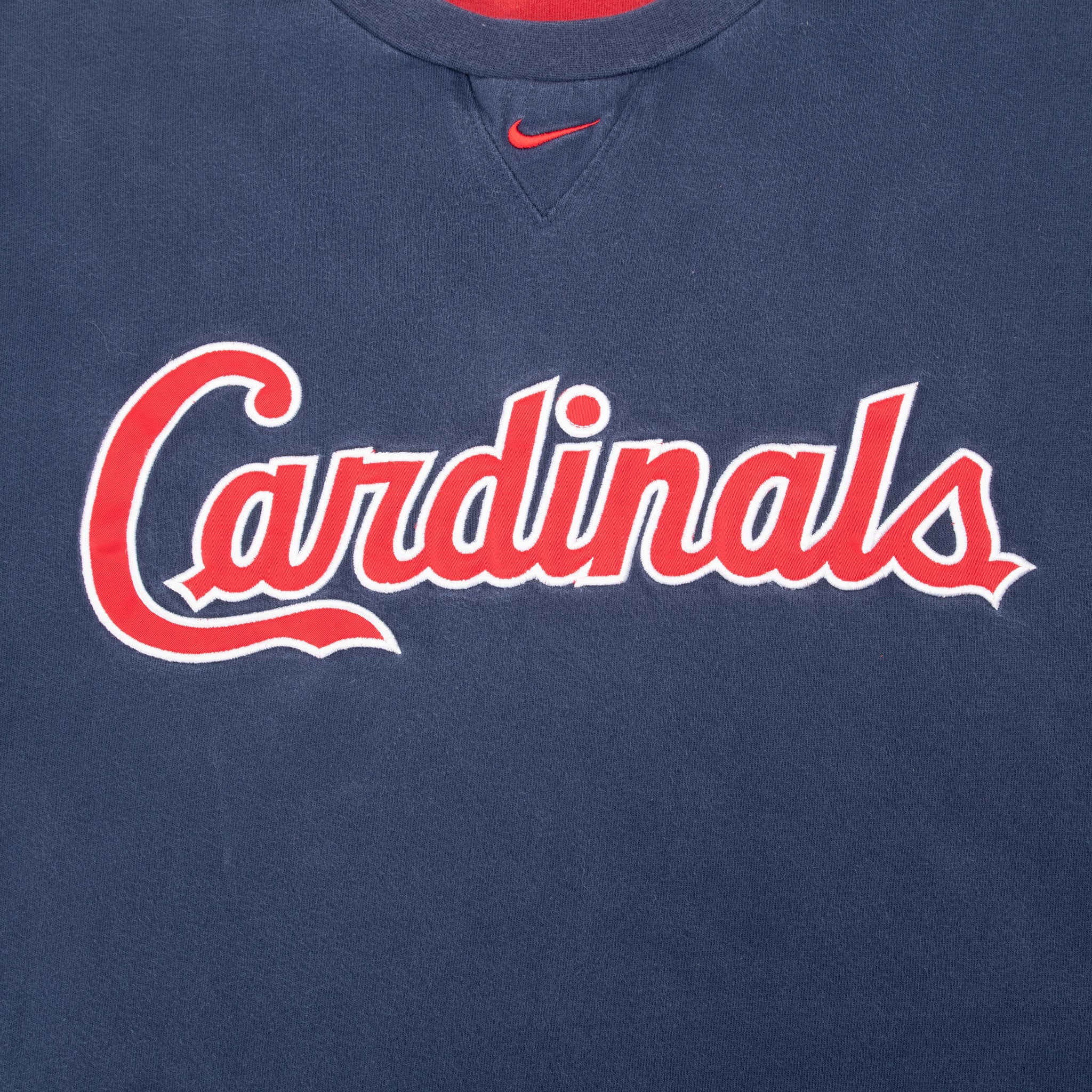 Red and white Cardinals script chest graphic with red Nike Swoosh above