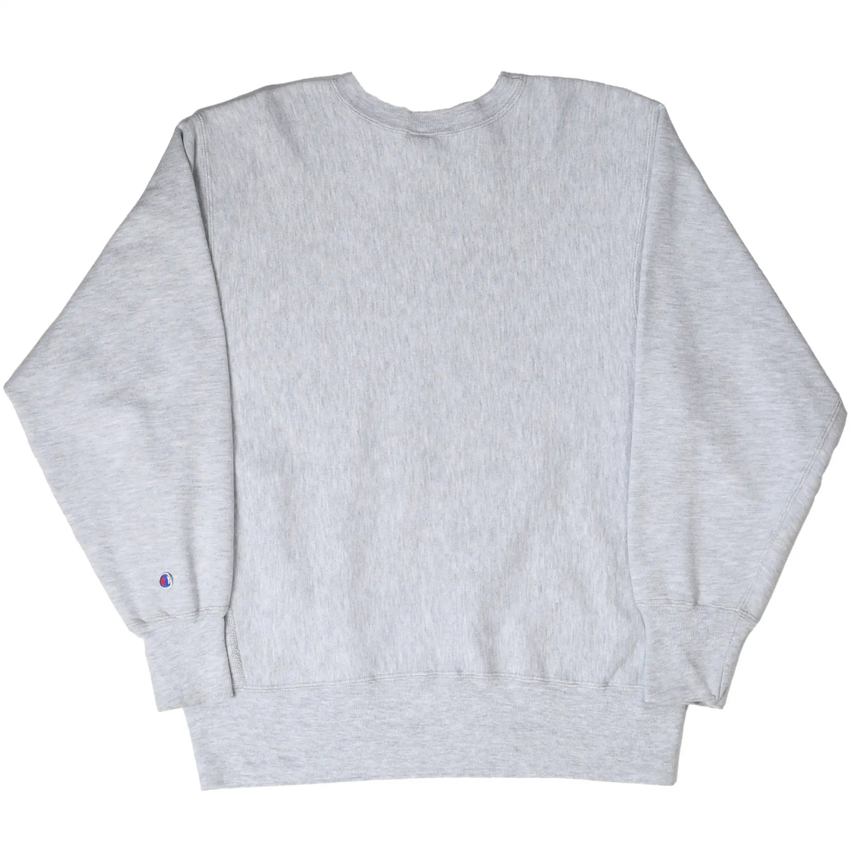 Back of plain gray Champion crewneck sweatshirt with logo patch on sleeve