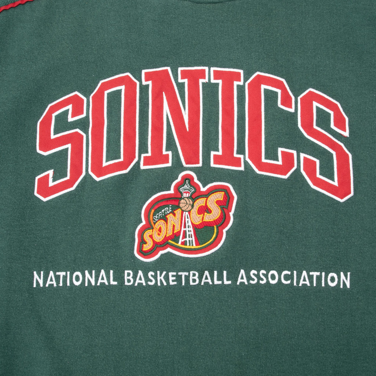 Close-up of embroidered Sonics lettering, Seattle SuperSonics logo and NBA text