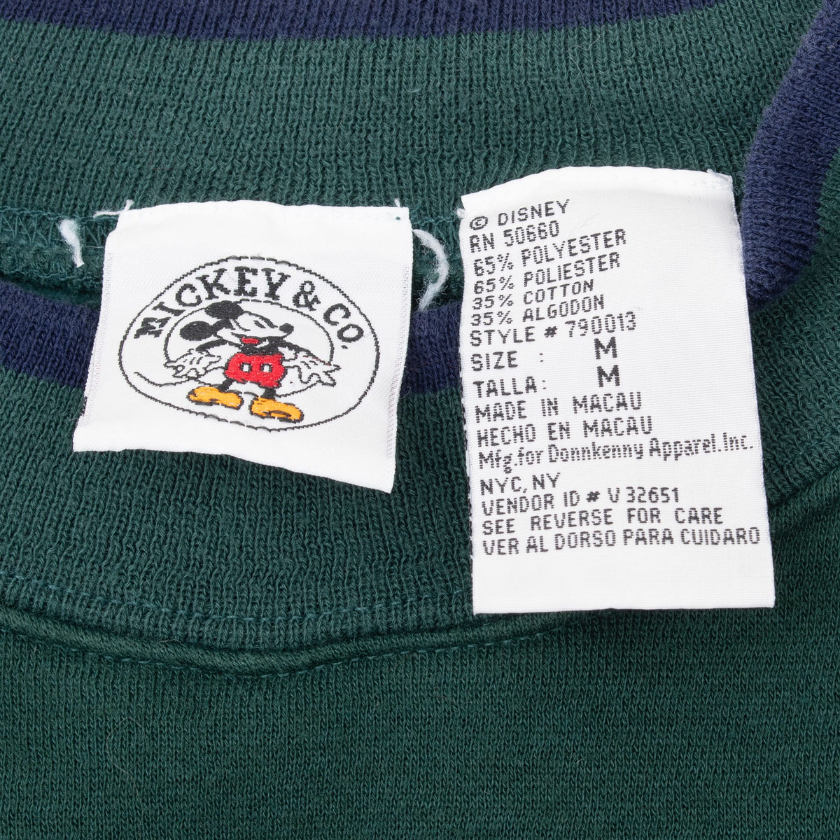 Mickey & Co. neck label and care tag showing size medium inside pine green sweatshirt