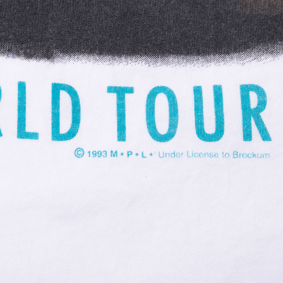 Close-up of 1993 copyright and Brockum licensing text beneath the tour print